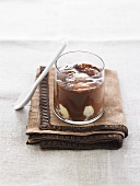 Vanilla ice cream with warm chocolate sauce in a glass