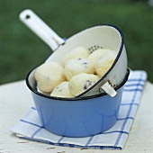 Blueberry dumplings in a strainer