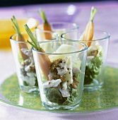 Turkey salad with nuts in four glasses