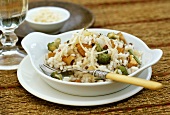 Vegetable rice with chanterelles and grated cheese