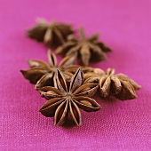 Star anise on pink background