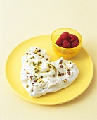 Heart-shaped pistachio & chocolate chip meringue with passion fruit