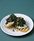 Kale and mascarpone on grilled crostini