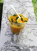 Orange and grapefruit salad with mint in a glass