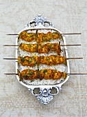 Grilled chicken tikka kebabs on rice