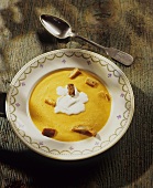 Pumpkin soup with croutons and whipped cream
