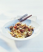 Tagliatelle with squid and tomatoes