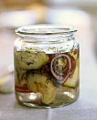 Pickled cucumber with onion in jar
