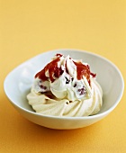 Meringue with raspberry cream and strawberry sauce