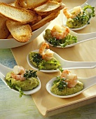Avocado cream with prawns and baguette slices