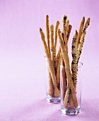 Sesame bread sticks in two glasses