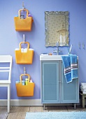 Bathroom with washstand, mirror, bags for storage