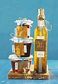 Jars of preserves and bottle of oil to give as gifts