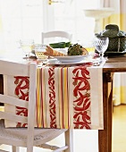 Laid table decorated with vegetables