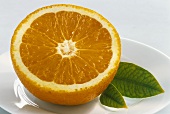 Half an orange with leaves