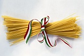 Bundle of spaghetti tied with striped ribbon