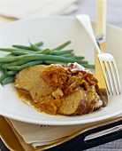 Braised veal with vegetable and white wine sauce and beans