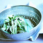 Cucumber with wakame and sesame seeds on rice