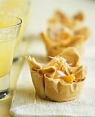 Filo pastry baskets with coconut cream and mandarins