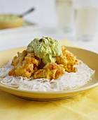 Battered shimps with avocado cream on a bed of glass noodles