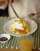 Poached egg on toast with Hollandaise sauce and fish