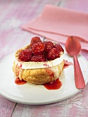 Puff pastry profiterole with goat's cheese and raspberries