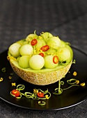 Melon salad with chilli rings and limes