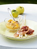 Grissini with parma ham and quince and mango chutney