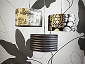 Pendant lights with wallpaper with a black and white designe