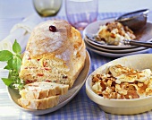 Filled ciabatta and apple and raisin pudding with almonds