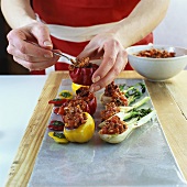 Stuffing baby vegetables with mince