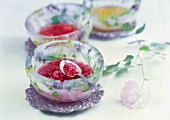 Cold raspberry soup in an ice bowl