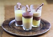 Three layered desserts: chocolate, vanilla & hazelnut blancmange