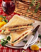 Ham and cheese sandwiches with tomato butter