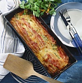 Vegetable terrine with schinkenspeck (cured pork) in baking dish