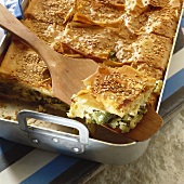 Courgette and leek pie, one piece on spatula