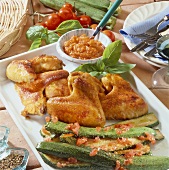 Grilled chicken wings with courgettes and tomato sauce