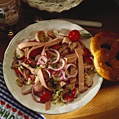 Sausage salad with sauerkraut and radishes