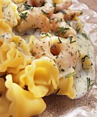 Prawns with dill cream sauce and pasta