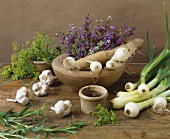 Still life with spring onions, garlic and herbs