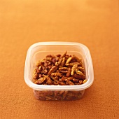 Dried chillies in a plastic container