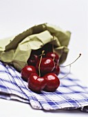 Heart cherries (sweet cherries) in a paper bag