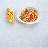 Fusilli with tomato and chilli, garlic baguette