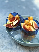 Fruit salad with cake croûtons in glasses, on ice