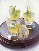 Three glasses of pear cocktail with dried pear slices