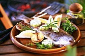 A trout with herbs