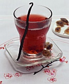 Red punch with vanilla and brown sugar crystals