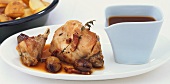 Oven-baked rabbit with balsamic onions