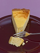 A piece of cheesecake with a fork