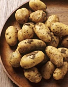 Potatoes on wooden platter